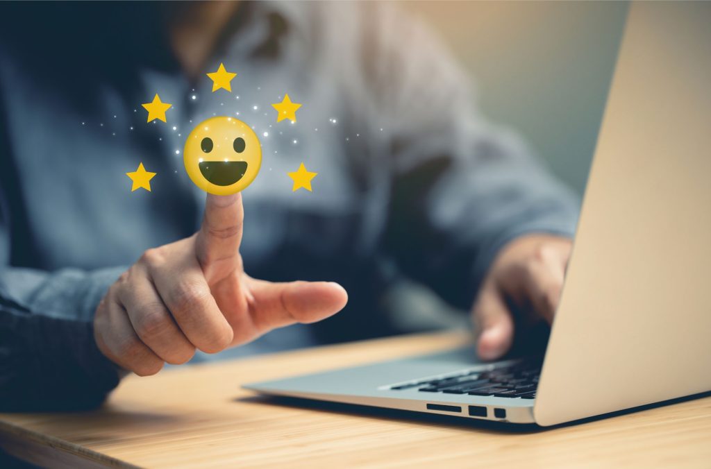 Customer Satisfaction Emoji With Man At Laptop